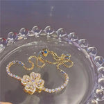 Electroplated 14k Gold Rotating Flower Bracelet