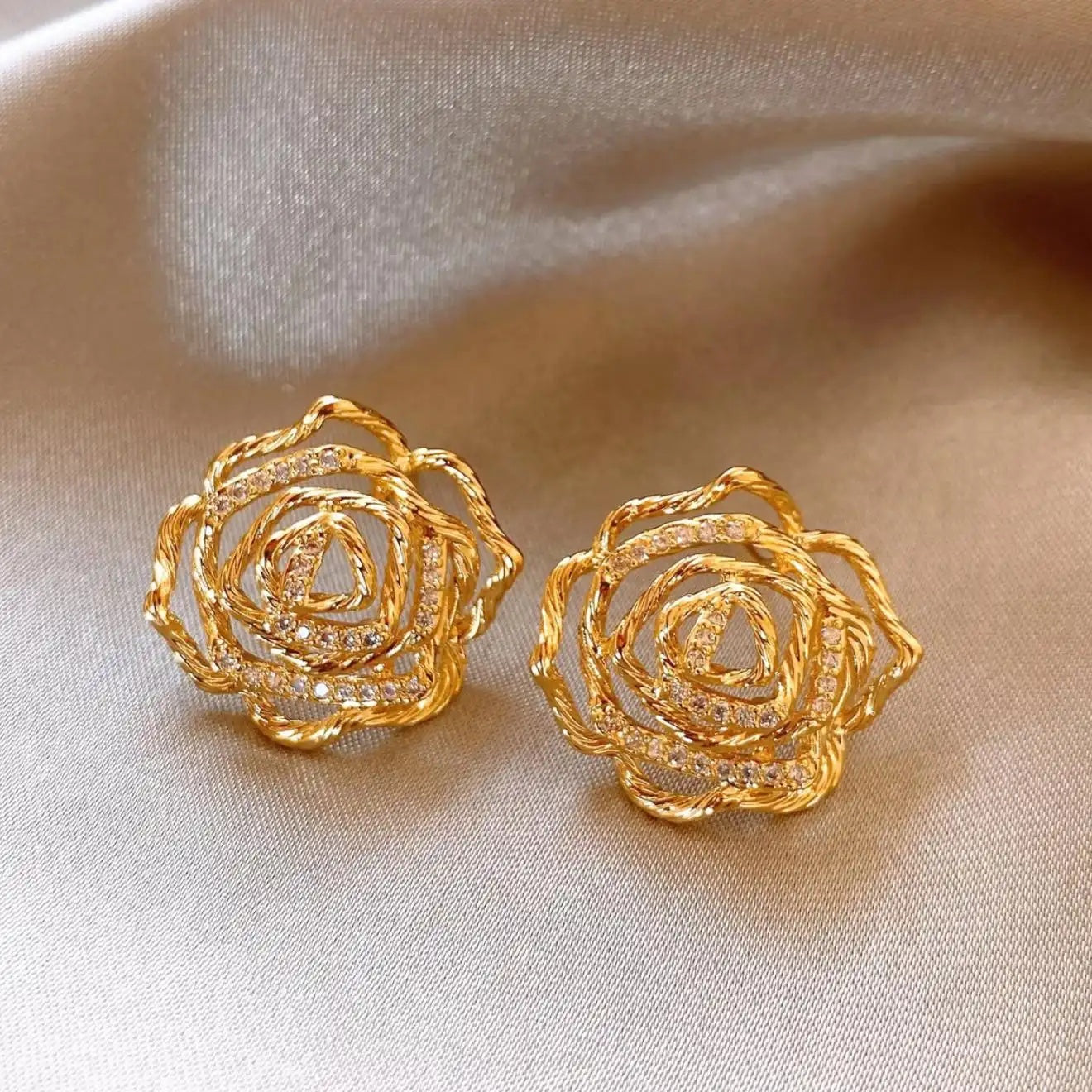 Gold Twisted Hollow Flower Stud Earrings