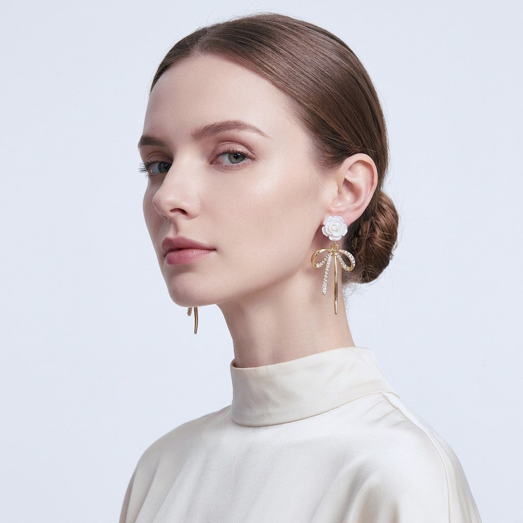 Woman wearing White Rose Bow Drop Earrings