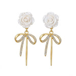 White Rose Bow Drop Earrings on a white background